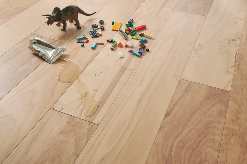 Closeup of hardened wood flooring with children
