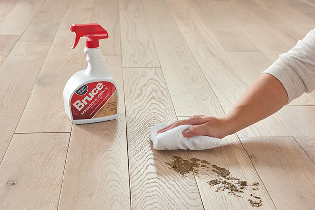 cleaning up dirt with bruce hardwood flooring cleaner