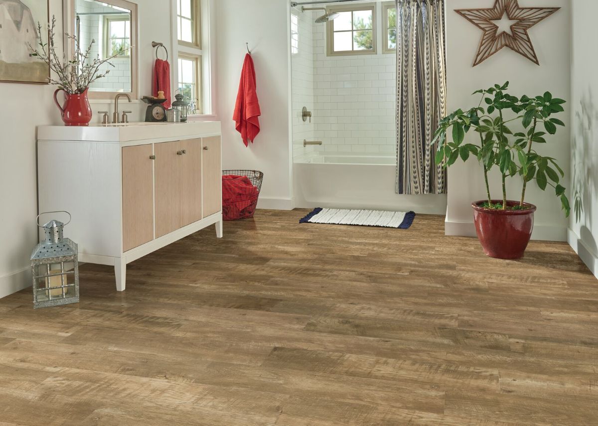 Liberty Forge luxury vinyl plank flooring in a bathroom; LVT is waterproof