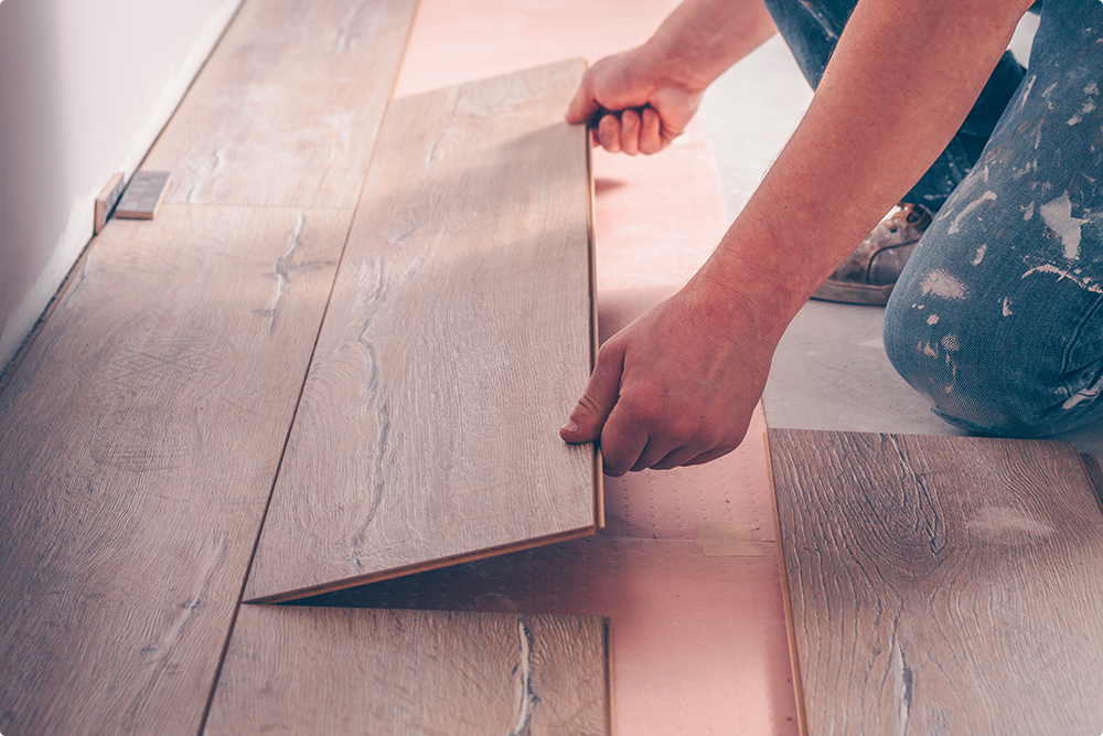 man installing bruce hardwood floors