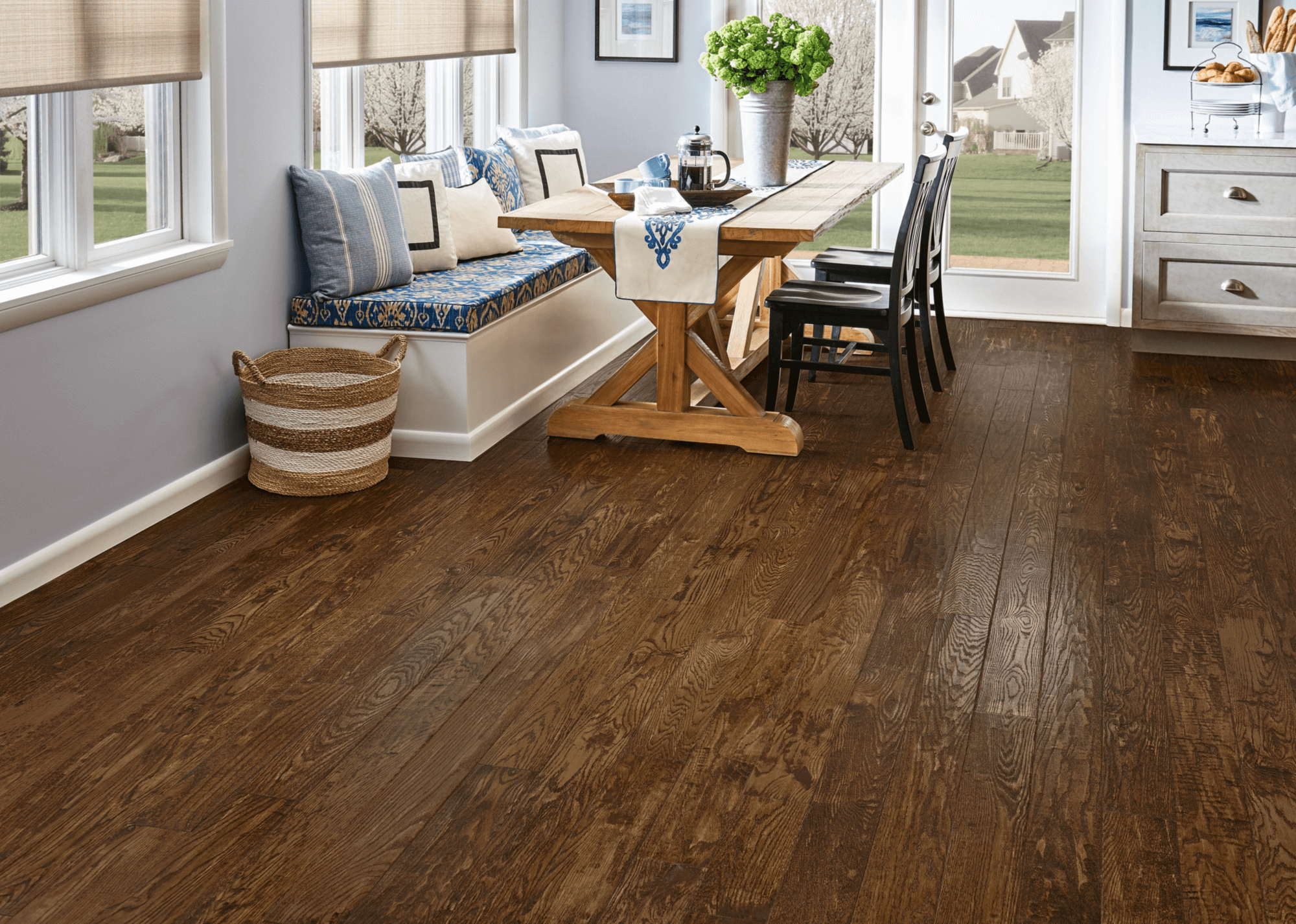 Dinette area with views into a neighborhood featuring hand-scraped oak hardwood flooring