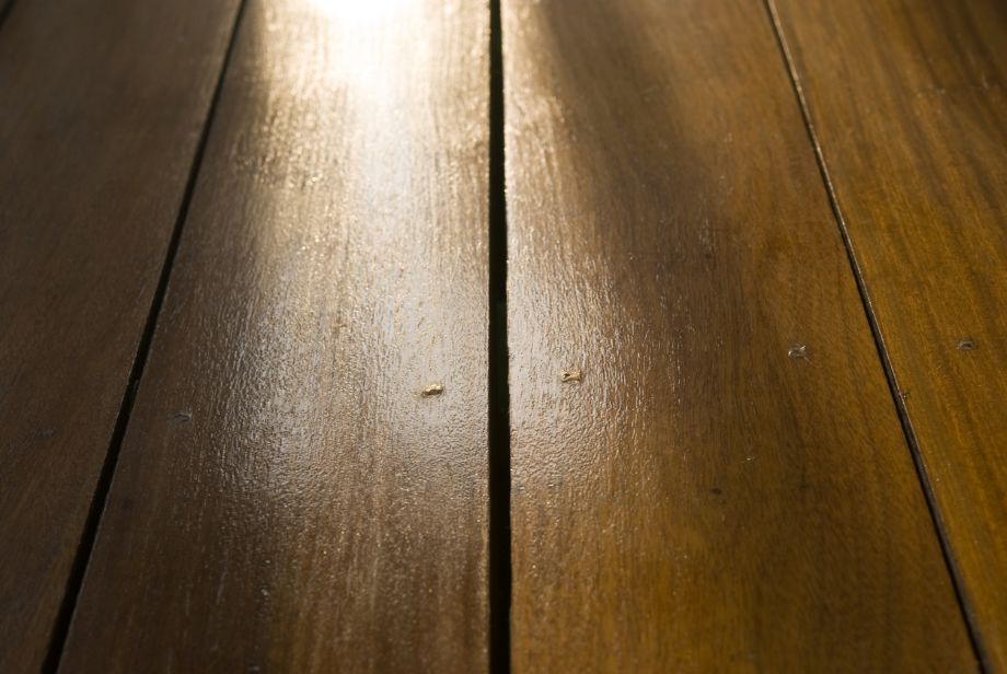 Close up of wood flooring with a gap from poor installation; acclimating wood floors